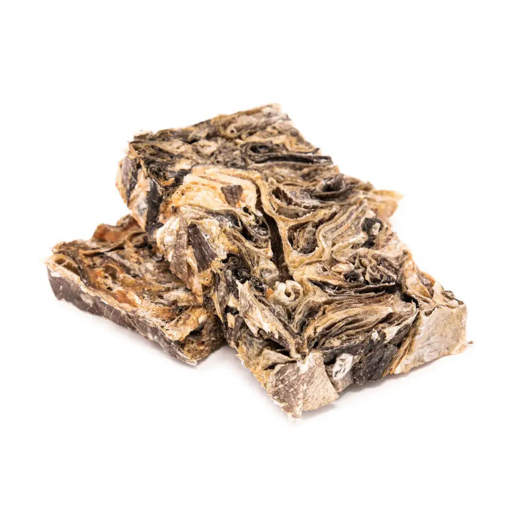 Two pieces of dried seaweed on a white background