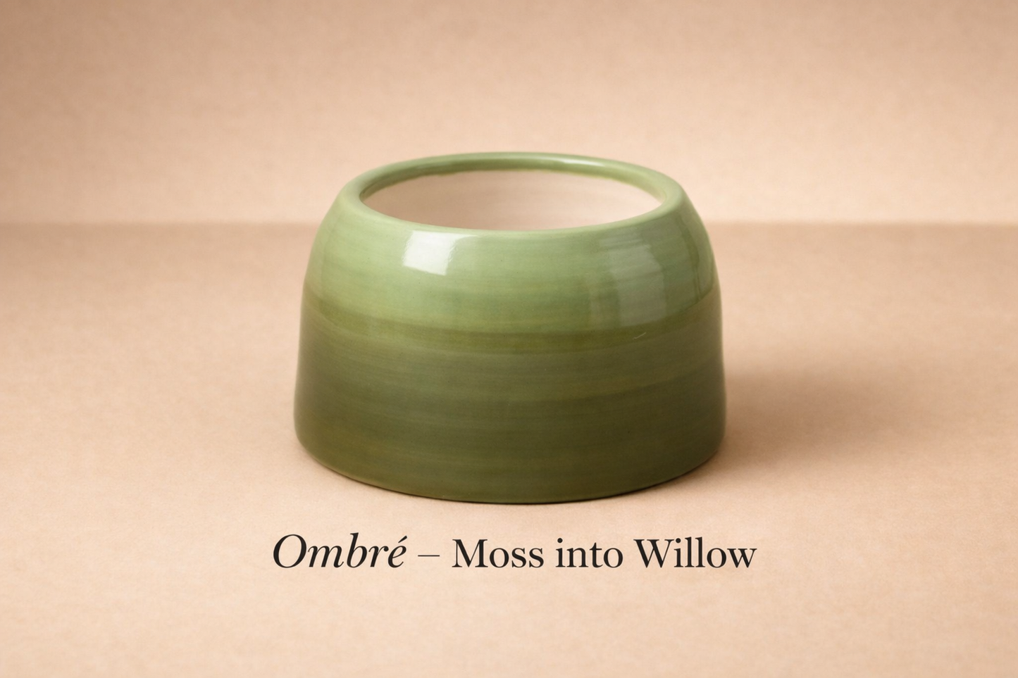 Green ceramic bowl with 'Ombre - Moss into Willow' text on a beige background