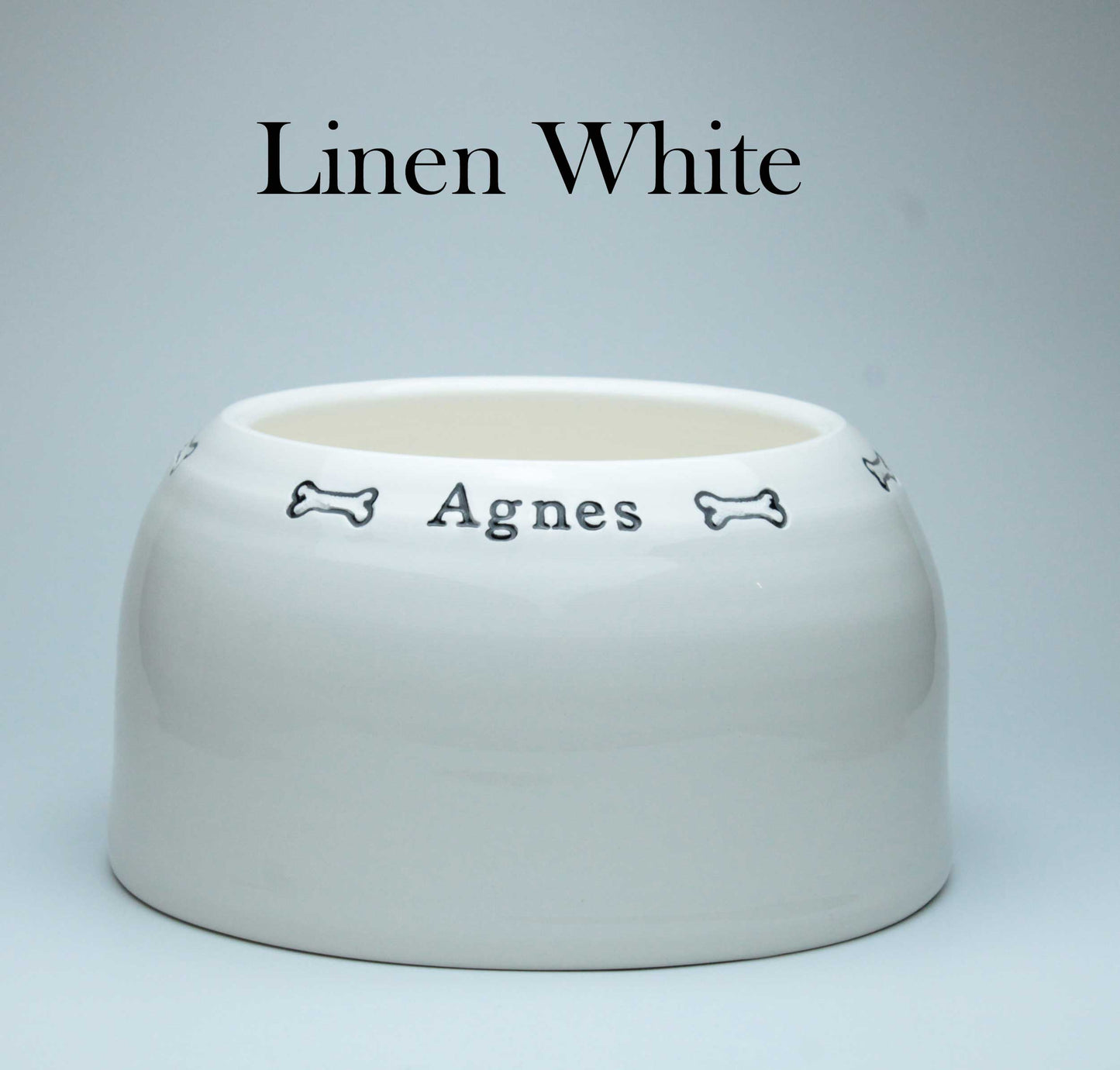 White ceramic bowl with 'Agnes' engraved on a light gray background