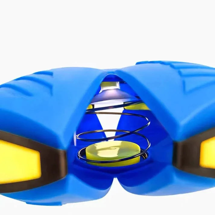 Blue and yellow dog frisbee with a central spiral mechanism on a white background