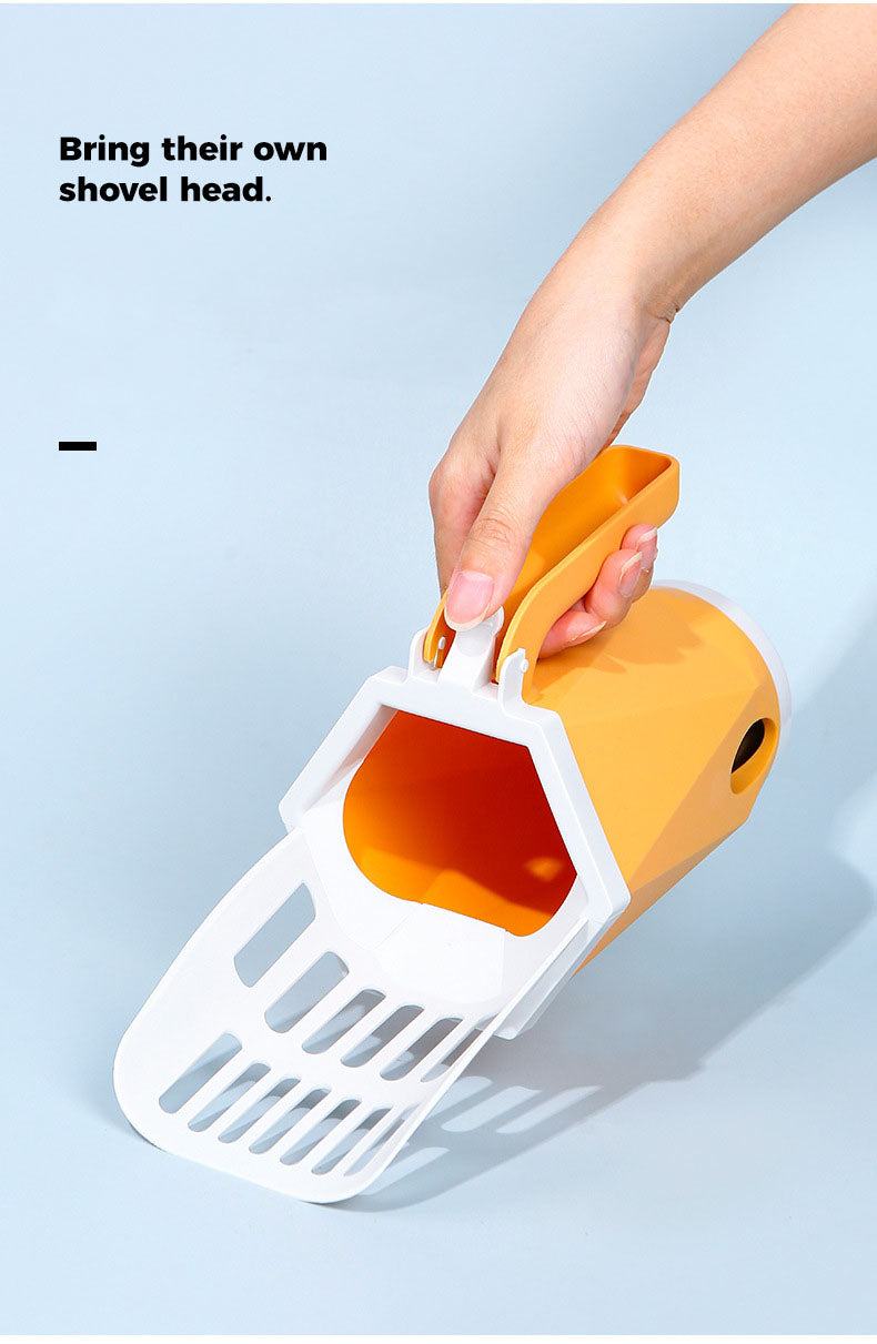 Hand holding a white and orange pet litter scoop against a light blue background