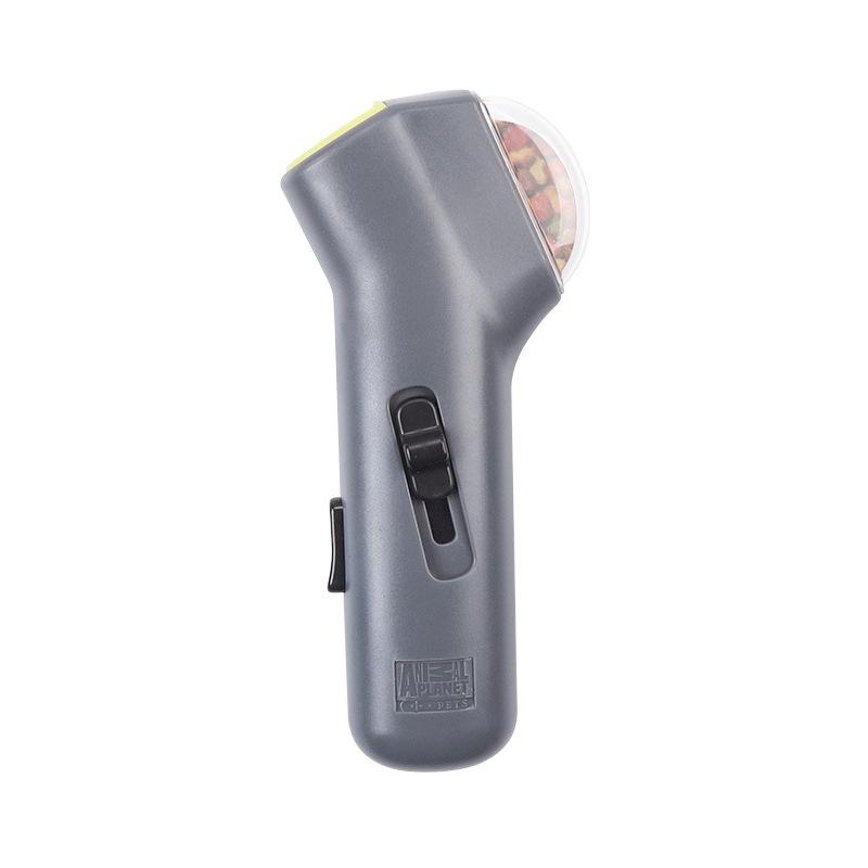 Gray pet treat launcher with a switch on a white background