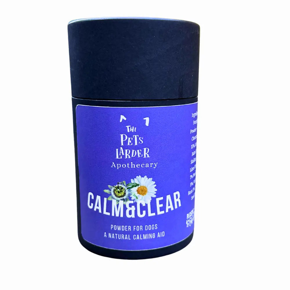 Container of 'Calm & Clear' powder for dogs by The Pets Larder Apothecary on a white background