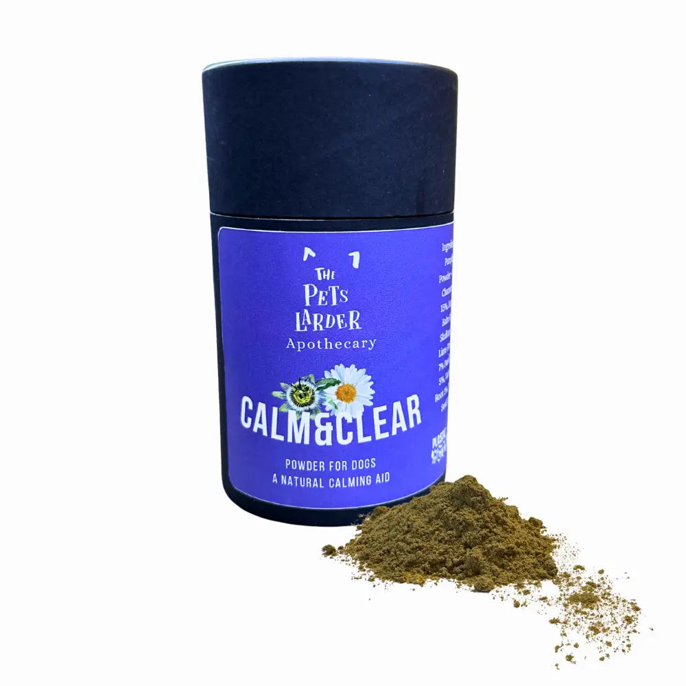 Container of 'Calm & Clear' powder for dogs by The Pet's Larder Apothecary on a white background