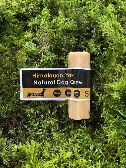 Himalayan Yak Natural Dog Chew with packaging on a green moss background