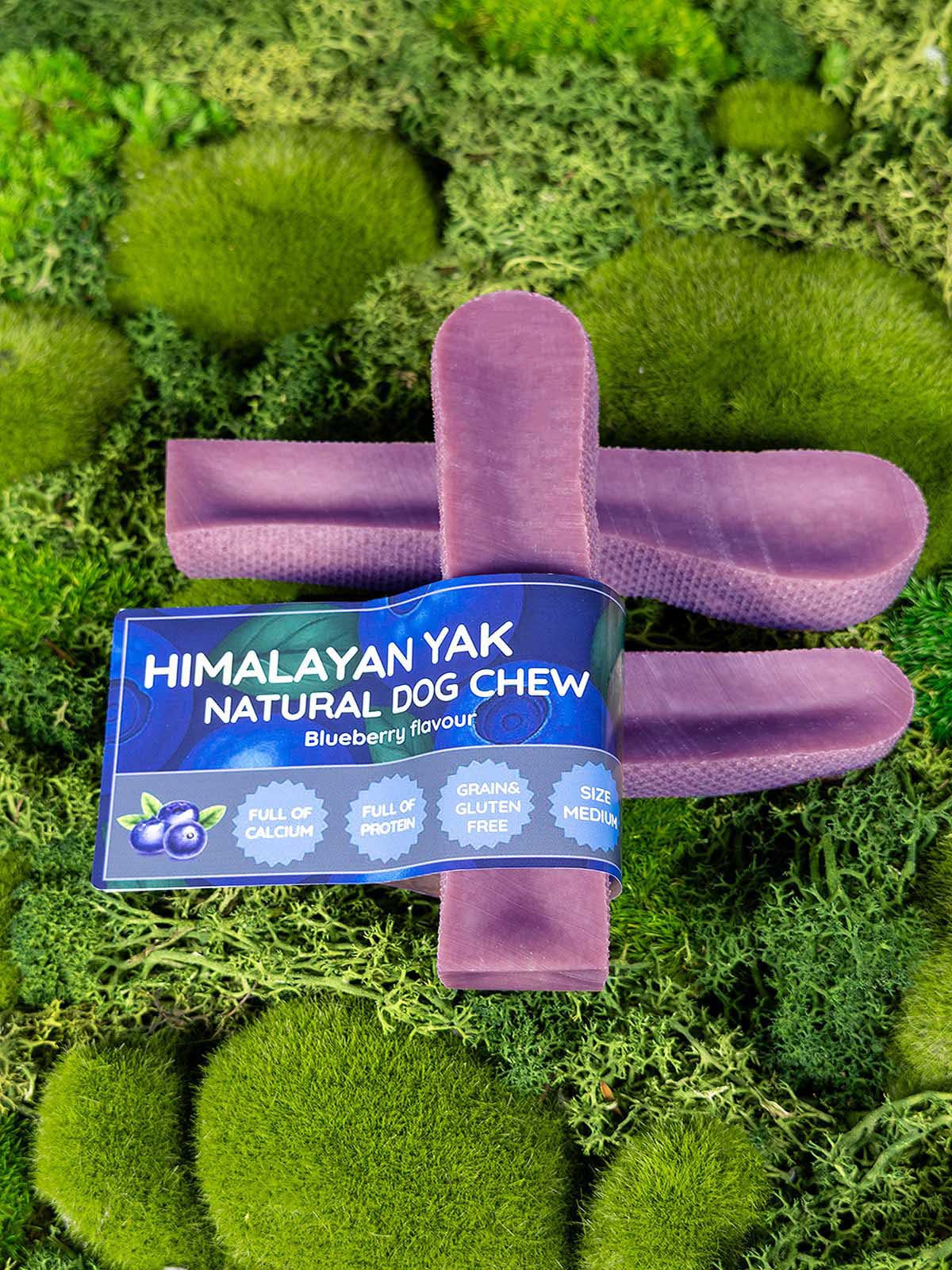Himalayan Yak Natural Dog Chew packaging on a green moss background