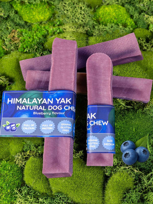 Himalayan Yak Natural Dog Chew packaging with purple chew treat on a green moss background
