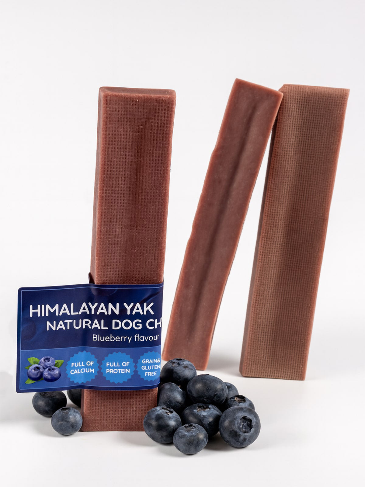 Himalayan Yak Natural Dog Chews with blueberries on a white background