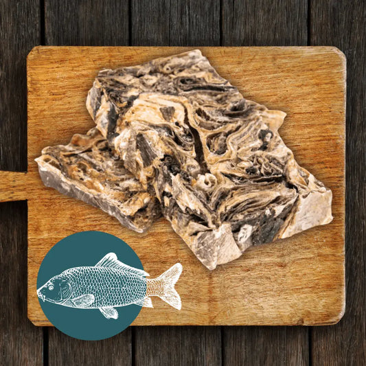 Dried fish on a wooden cutting board with a fish illustration in the corner.