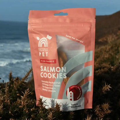 Package of salmon cookies for pets with a scenic background