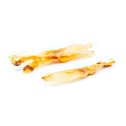 Two pieces of dried fish on a white background