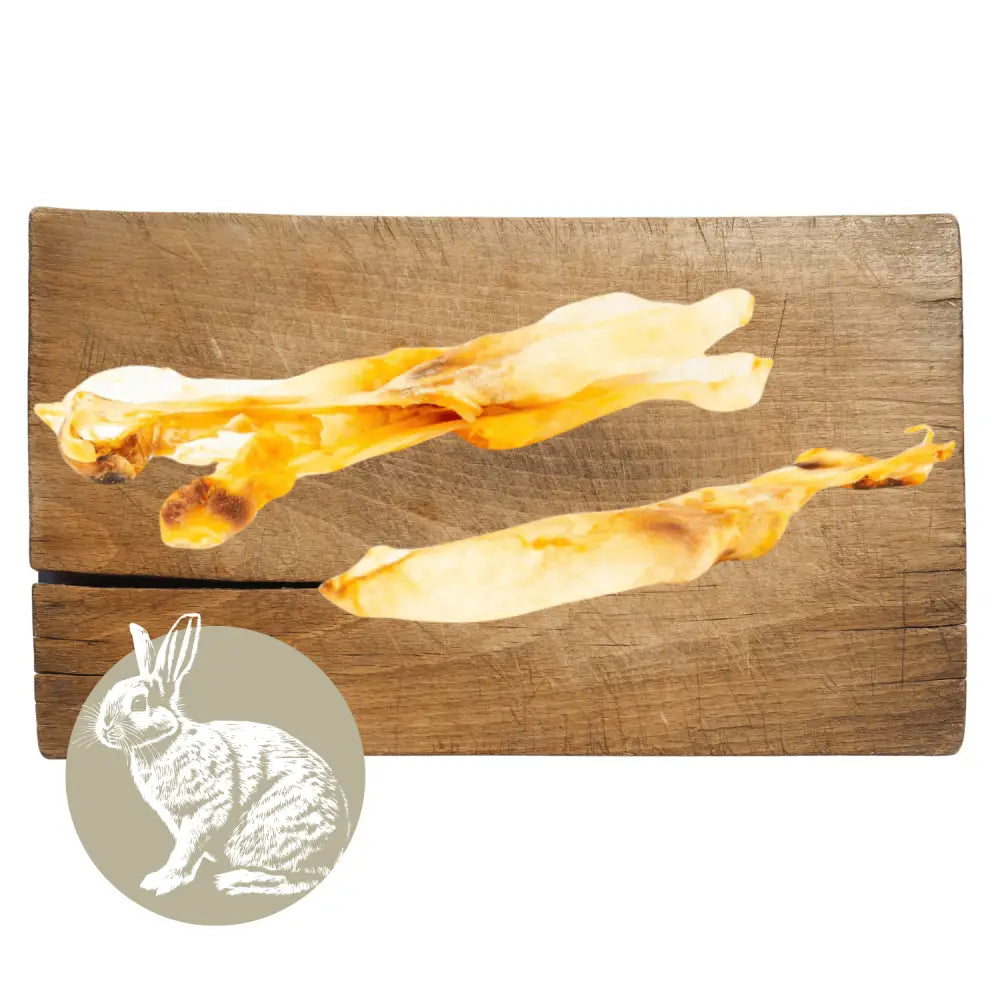 Wooden cutting board with abstract rabbit design and inset of a rabbit illustration.