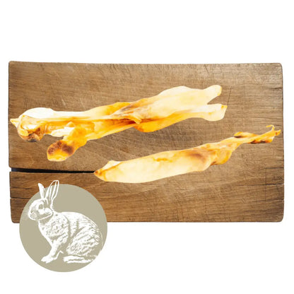 Wooden cutting board with abstract rabbit design and inset of a rabbit illustration.