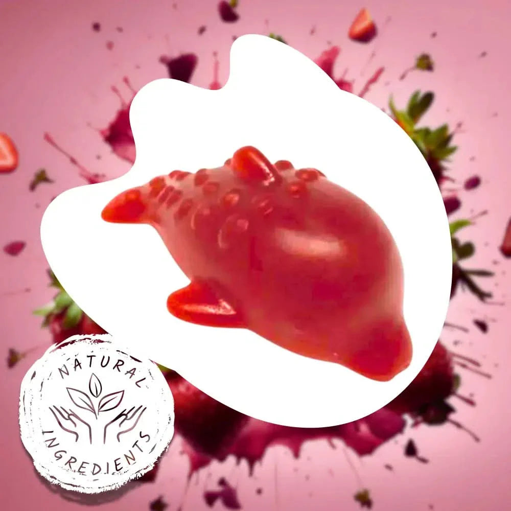 Red gummy bear with strawberry pieces and 'Natural Ingredients' label on a pink background